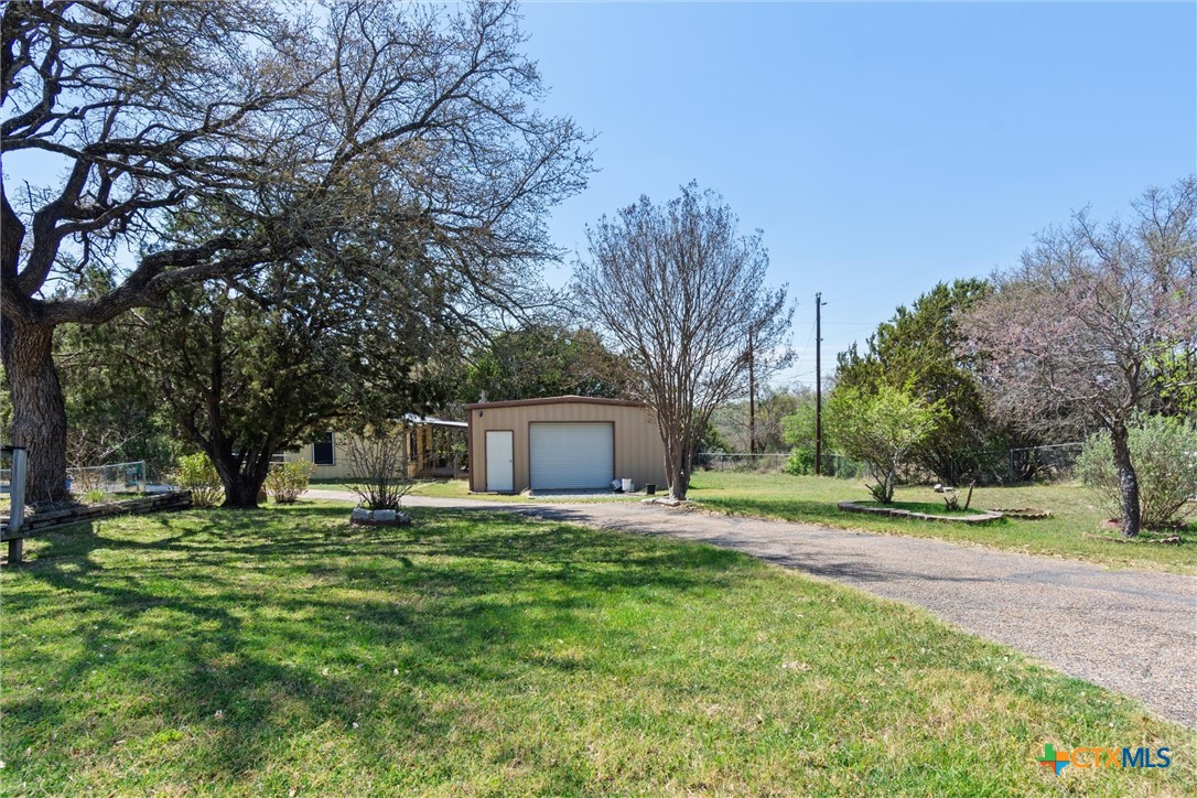 3037 Boys Ranch Road Kempner, TX 76539 - Photo 4 of 47 a house with a yard and trees