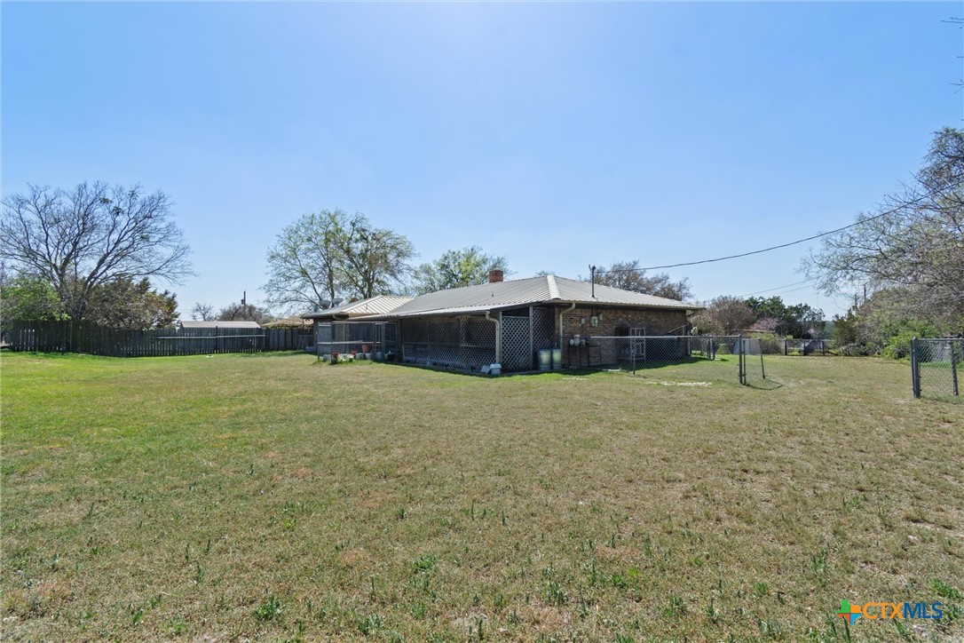 3037 Boys Ranch Road Kempner, TX 76539 - Photo 46 of 47 a tall tree in front of a field