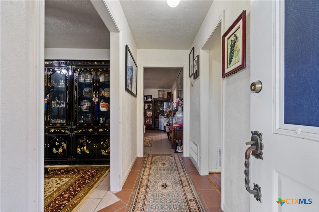 3037 Boys Ranch Road Kempner, TX 76539 - Photo 7 of 47 a view of a hallway with closet and a living room