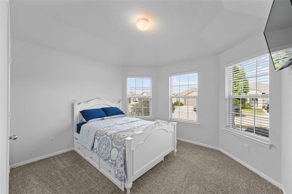 9020 Ridgeriver Way Fort Worth, TX 76131 - Photo 21 of 26 a bedroom with a bed and window