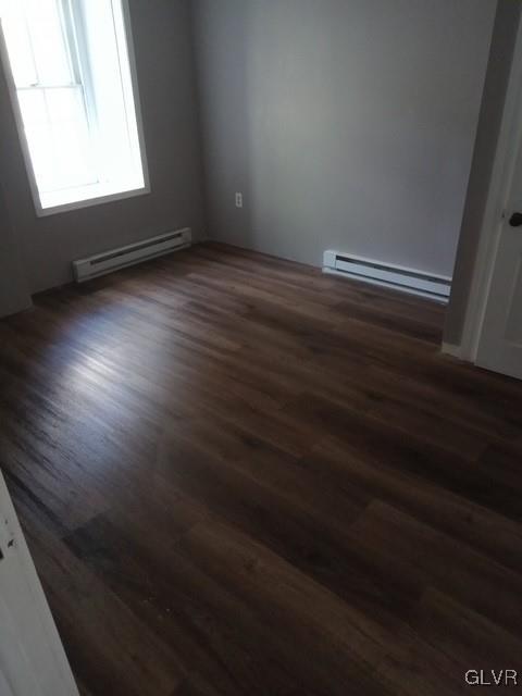 900 Mahantongo Street, Unit 7 Pottsville, PA 17901 - Photo 3 of 5 an empty room with wooden floor and windows