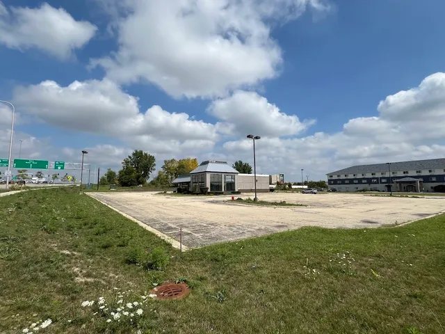 a view of a swimming pool and a yard