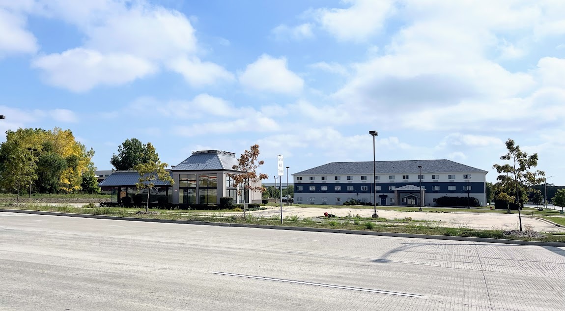 1290 Normantown Road Romeoville, IL 60446 - Photo 4 of 29 a front view of a house with a yard and fountain in the back