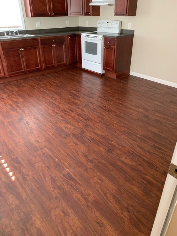 63 Brow Street Fall River, MA 02721 - Photo 14 of 35 a room with wooden floors and cabinets