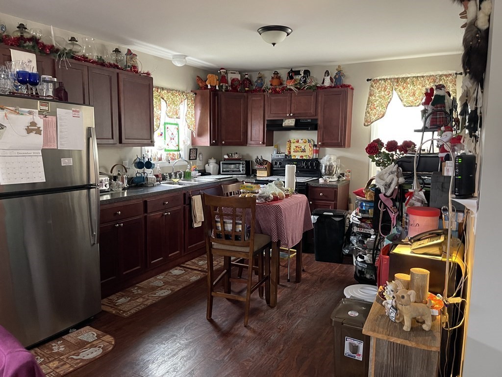 63 Brow Street Fall River, MA 02721 - Photo 2 of 35 a view of a kitchen with dining table and chairs