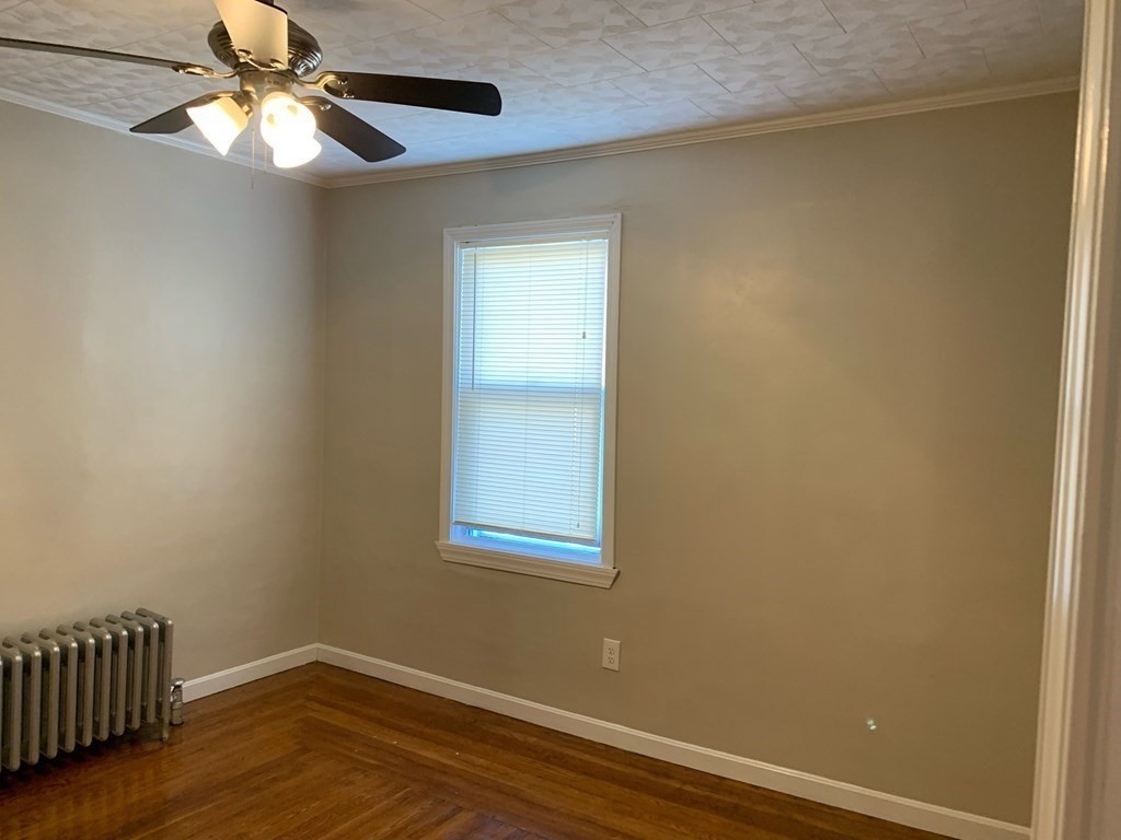 63 Brow Street Fall River, MA 02721 - Photo 26 of 35 an empty room with a window and a fan