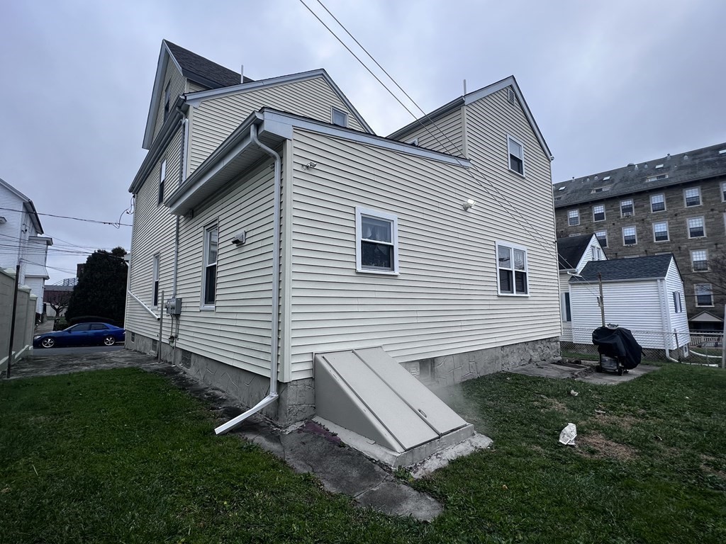 63 Brow Street Fall River, MA 02721 - Photo 34 of 35 a view of a backyard with a garden