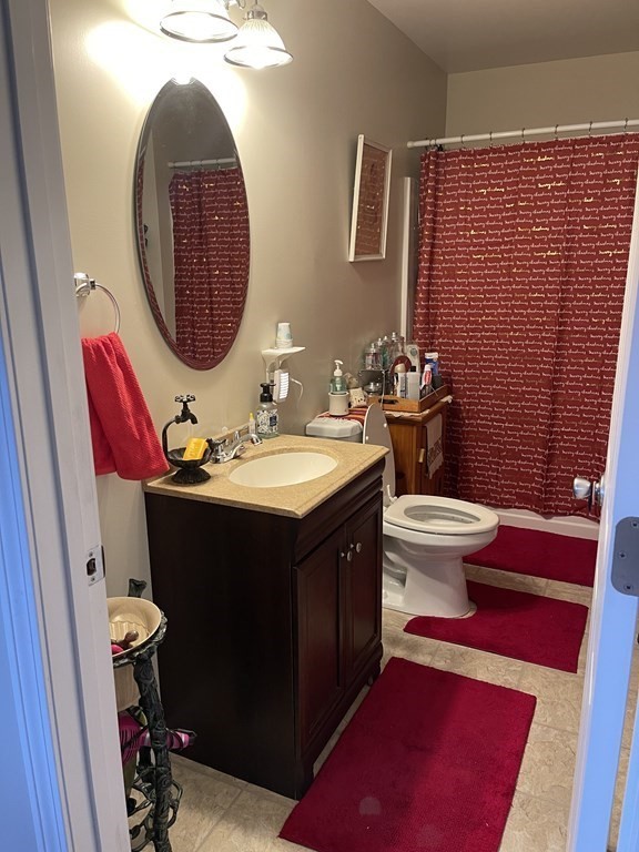 63 Brow Street Fall River, MA 02721 - Photo 9 of 35 a bathroom with a sink and a mirror