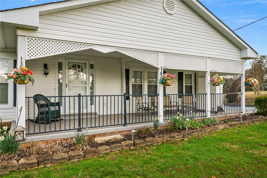 140 Fruit Mountain Road Easley, SC 29640 - Photo 2 of 35 Welcoming rocking chair front porch