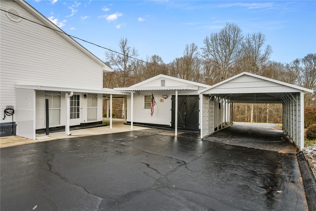 140 Fruit Mountain Road Easley, SC 29640 - Photo 25 of 35 Shed, workshop and carport. Drive at carport is pu