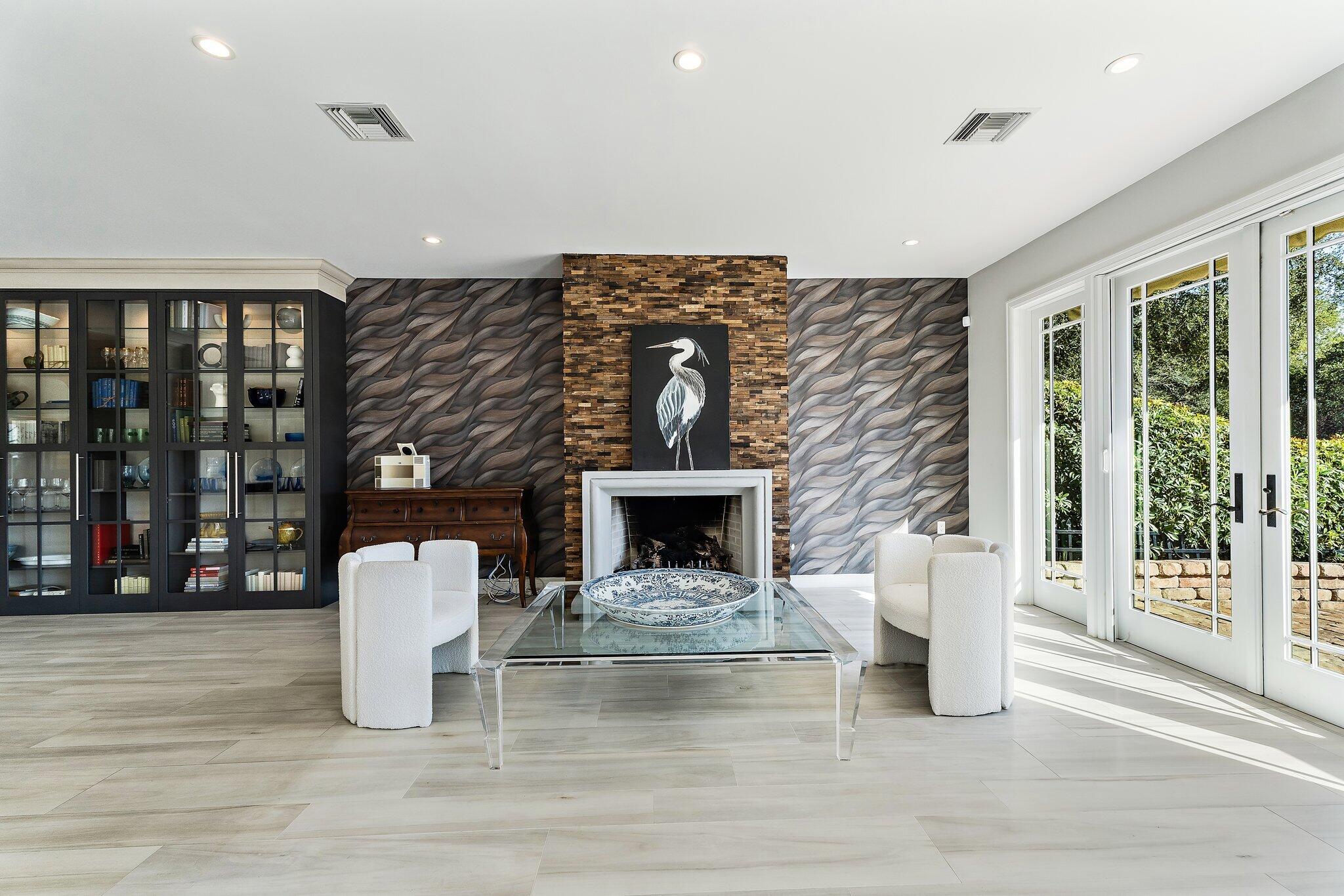 12092 Southeast Birkdale Run Jupiter, FL 33469 - Photo 13 of 53 a living room with fireplace furniture and a large window