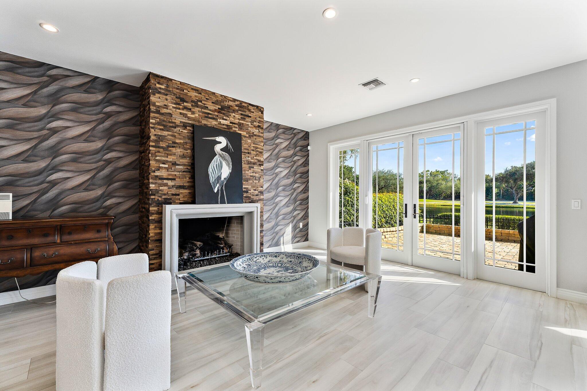 12092 Southeast Birkdale Run Jupiter, FL 33469 - Photo 14 of 53 a living room with furniture and a fireplace