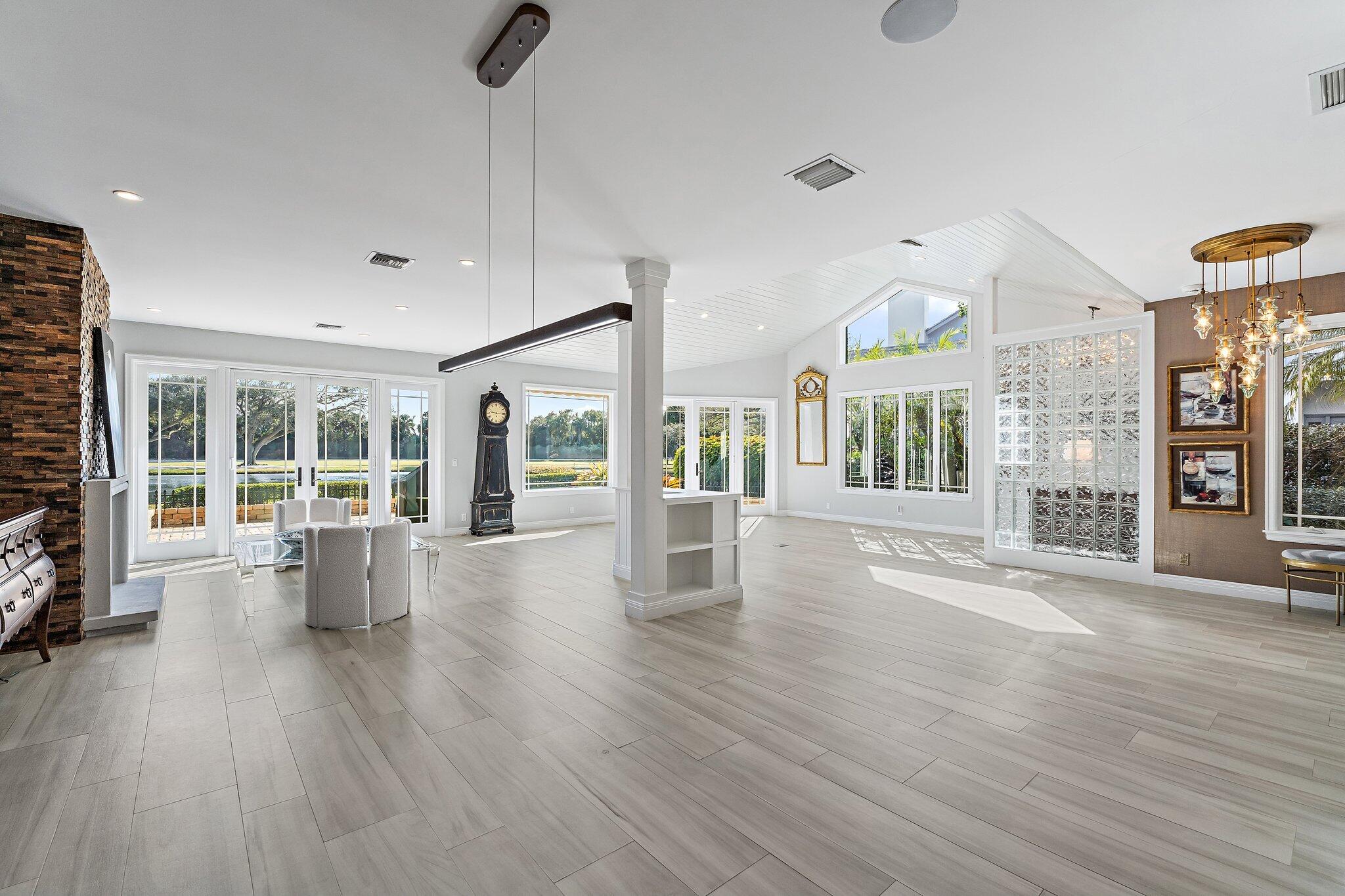 12092 Southeast Birkdale Run Jupiter, FL 33469 - Photo 20 of 53 a view of an empty room with wooden floor and a window