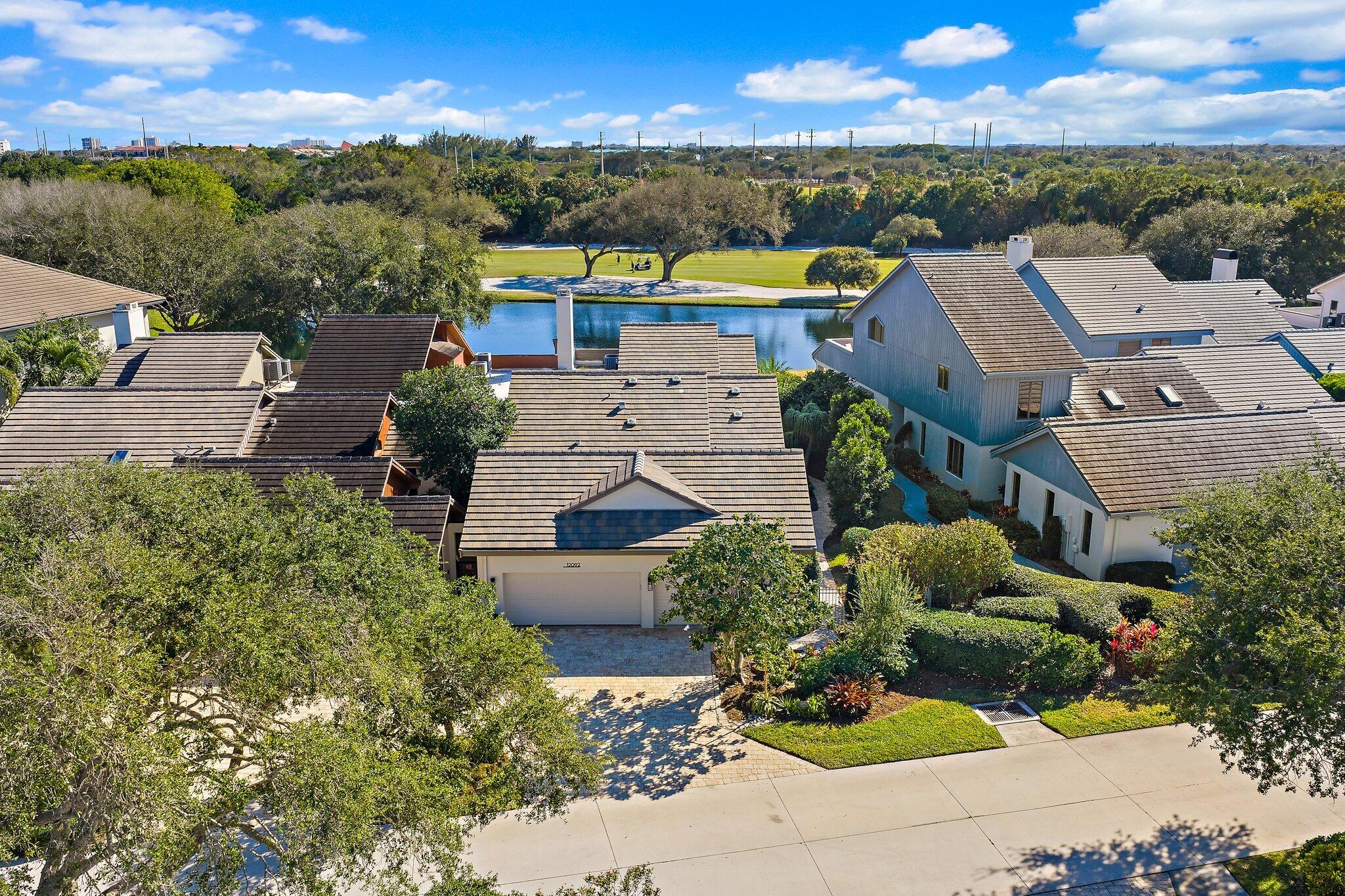 12092 Southeast Birkdale Run Jupiter, FL 33469 - Photo 2 of 53 an aerial view of a house with a garden