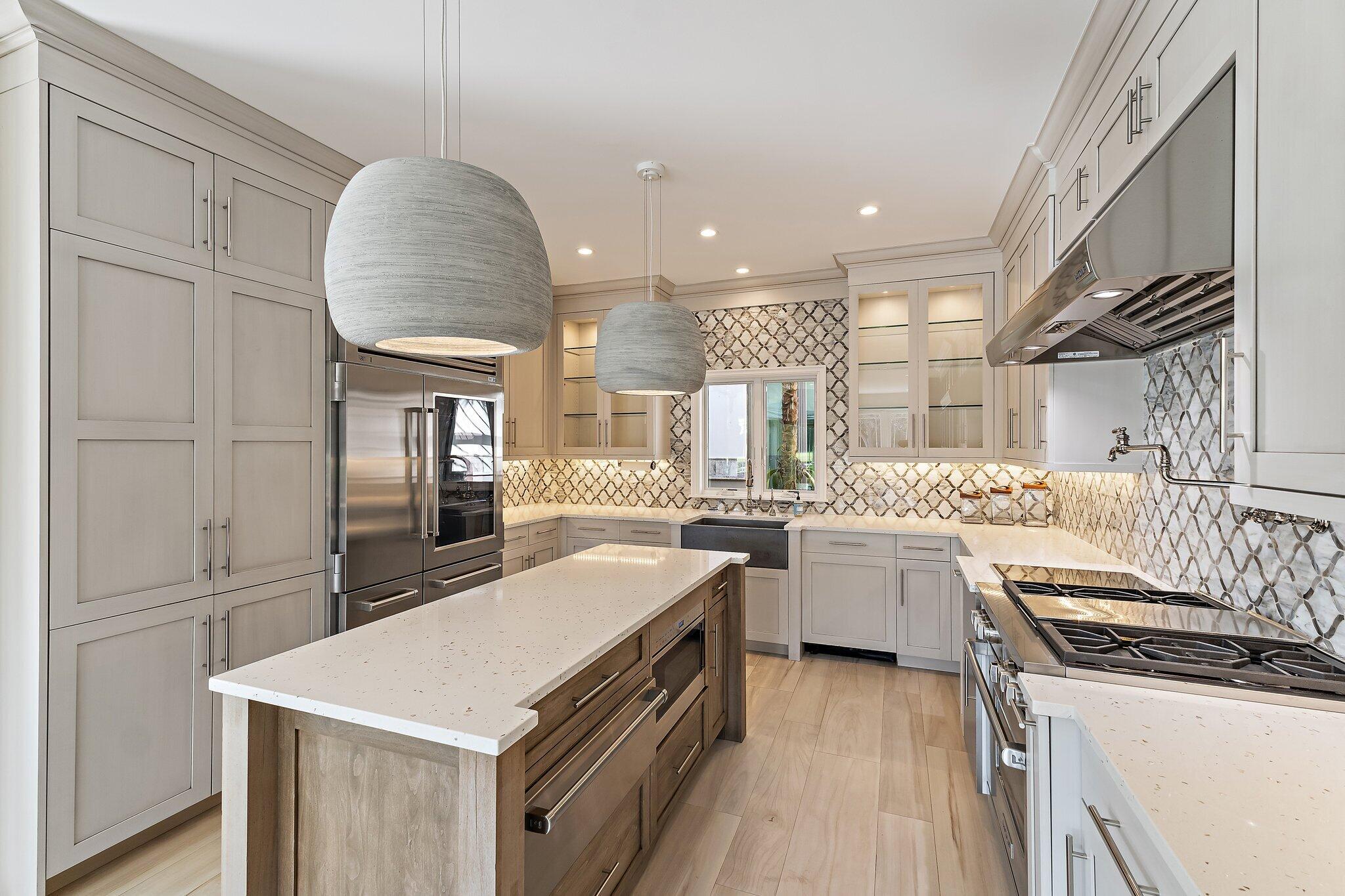 12092 Southeast Birkdale Run Jupiter, FL 33469 - Photo 23 of 53 a kitchen with a sink a stove and cabinets