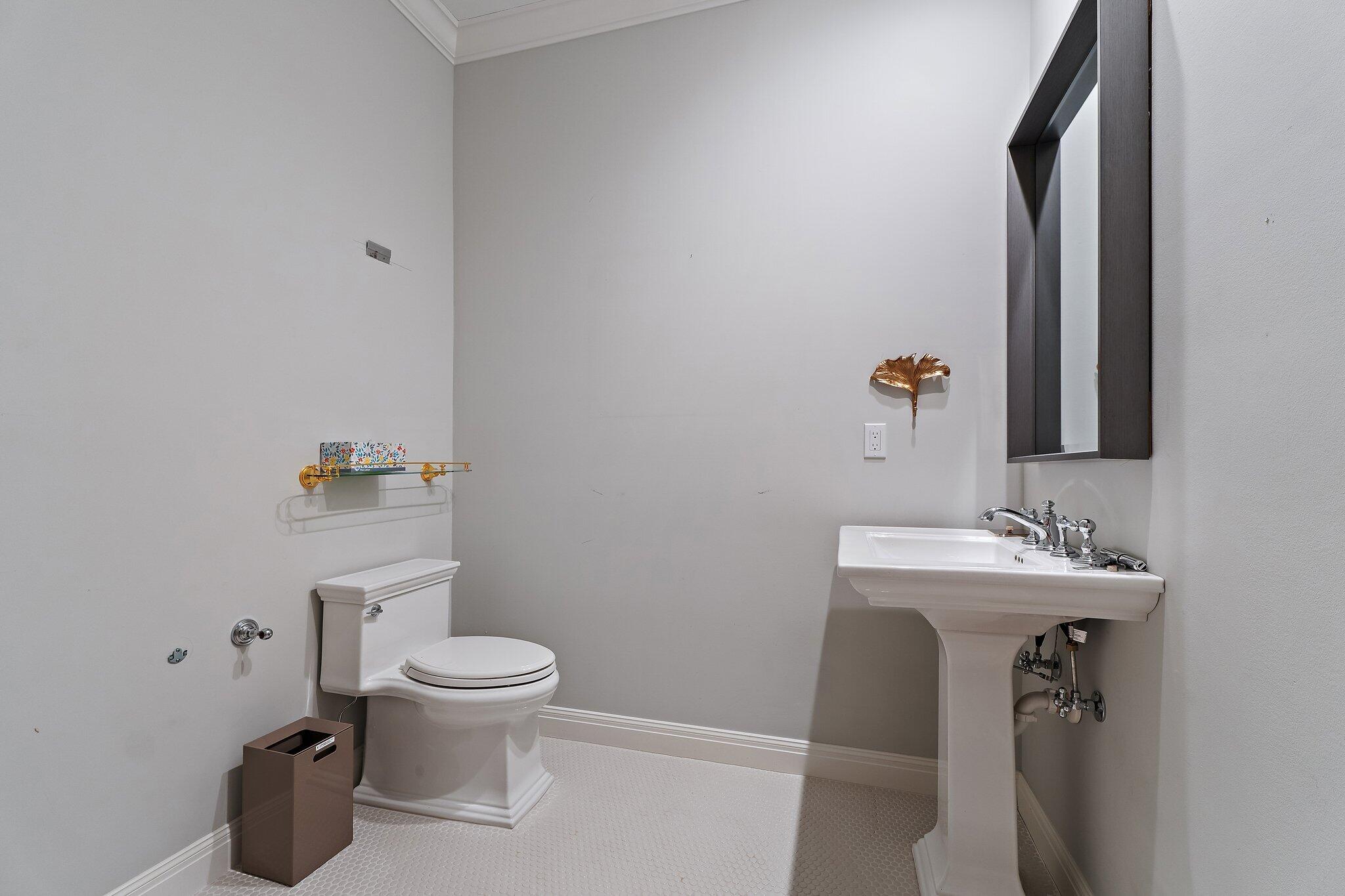 12092 Southeast Birkdale Run Jupiter, FL 33469 - Photo 37 of 53 a bathroom with a toilet sink and mirror