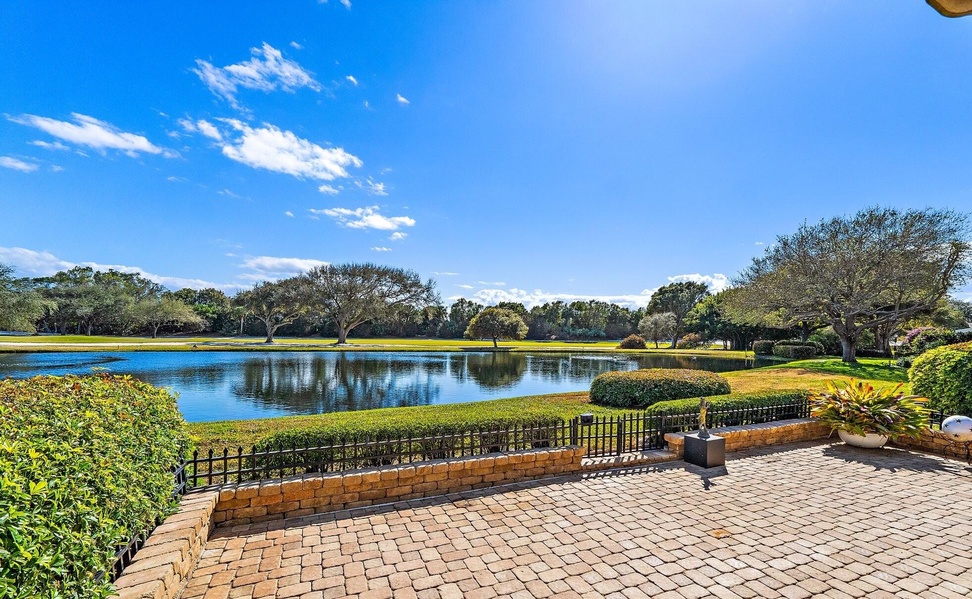 12092 Southeast Birkdale Run Jupiter, FL 33469 - Photo 45 of 53 a view of swimming pool with outdoor seating and lake