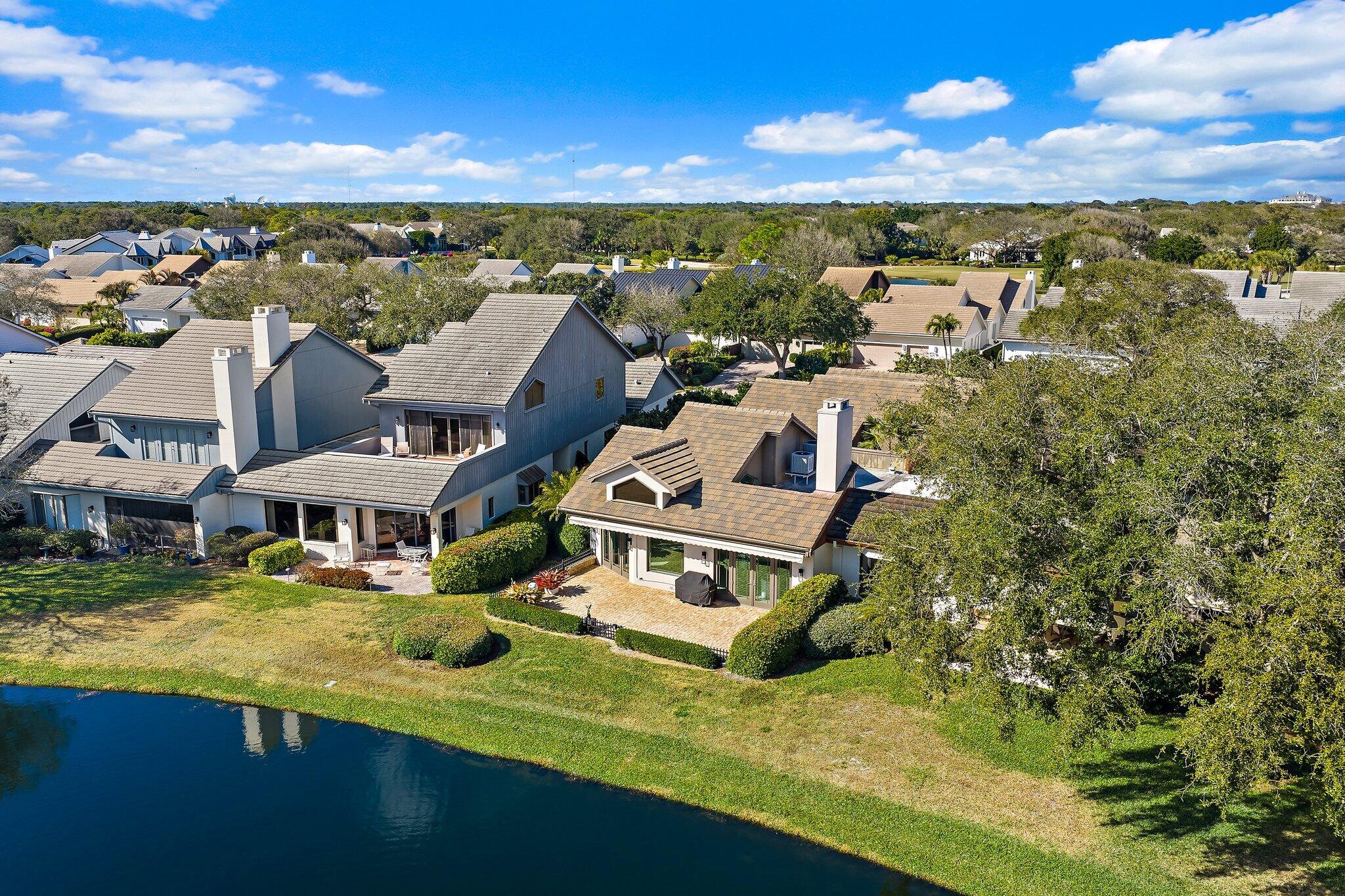 12092 Southeast Birkdale Run Jupiter, FL 33469 - Photo 47 of 53 an aerial view of residential houses with outdoor space and swimming pool