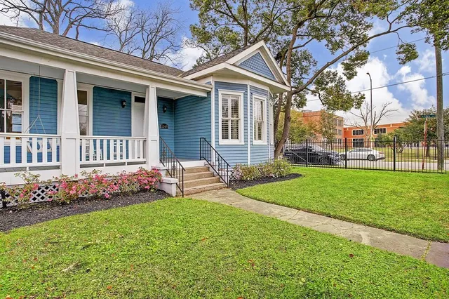 a front view of a house with garden