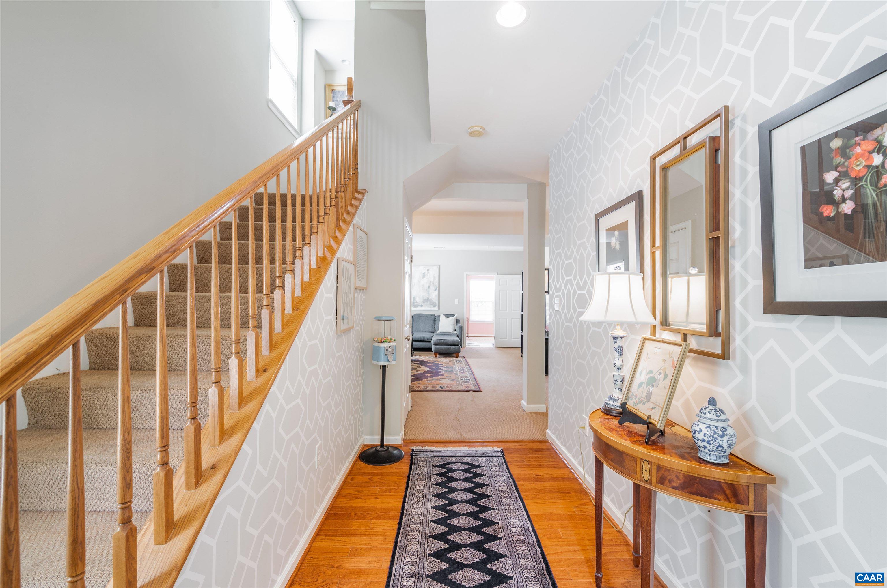 719 Rainier Road Charlottesville, VA 22903 - Photo 8 of 41 a view of a hallway with wooden floor and staircase