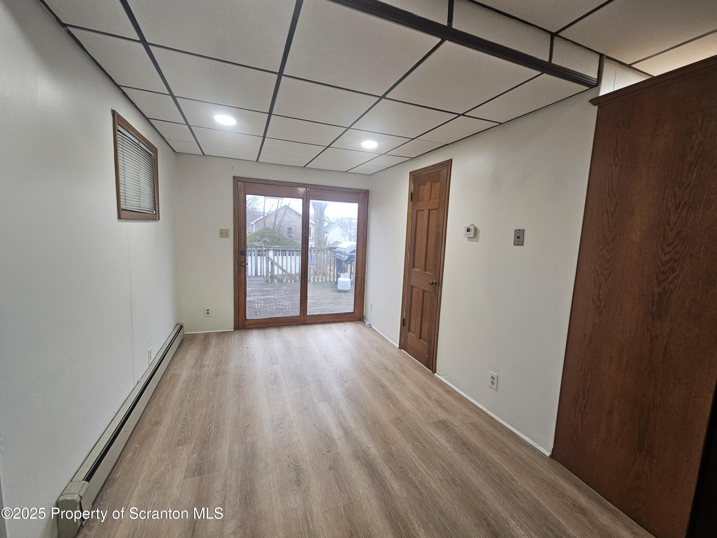 328 4th Street Blakely, PA 18447 - Photo 12 of 13 a view of hallway with wooden floor