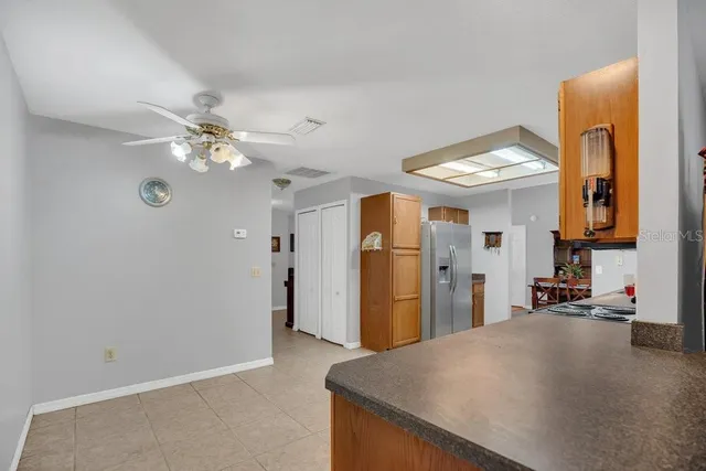 a view of a kitchen with furniture and a chandelier