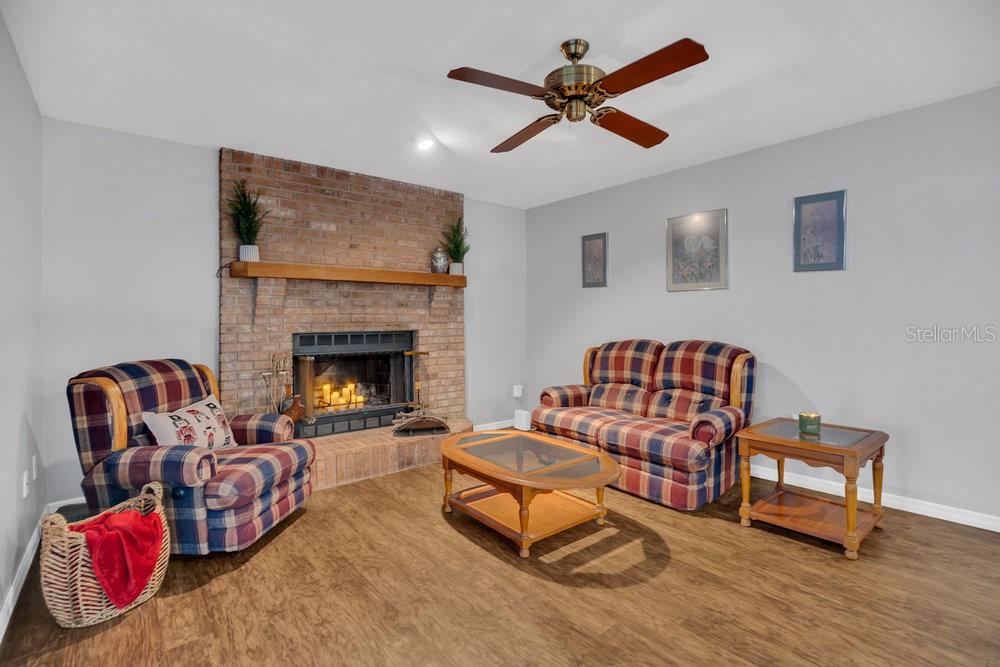 90 Sundown Road DeBary, FL 32713 - Photo 15 of 36 a living room with furniture fireplace and rug