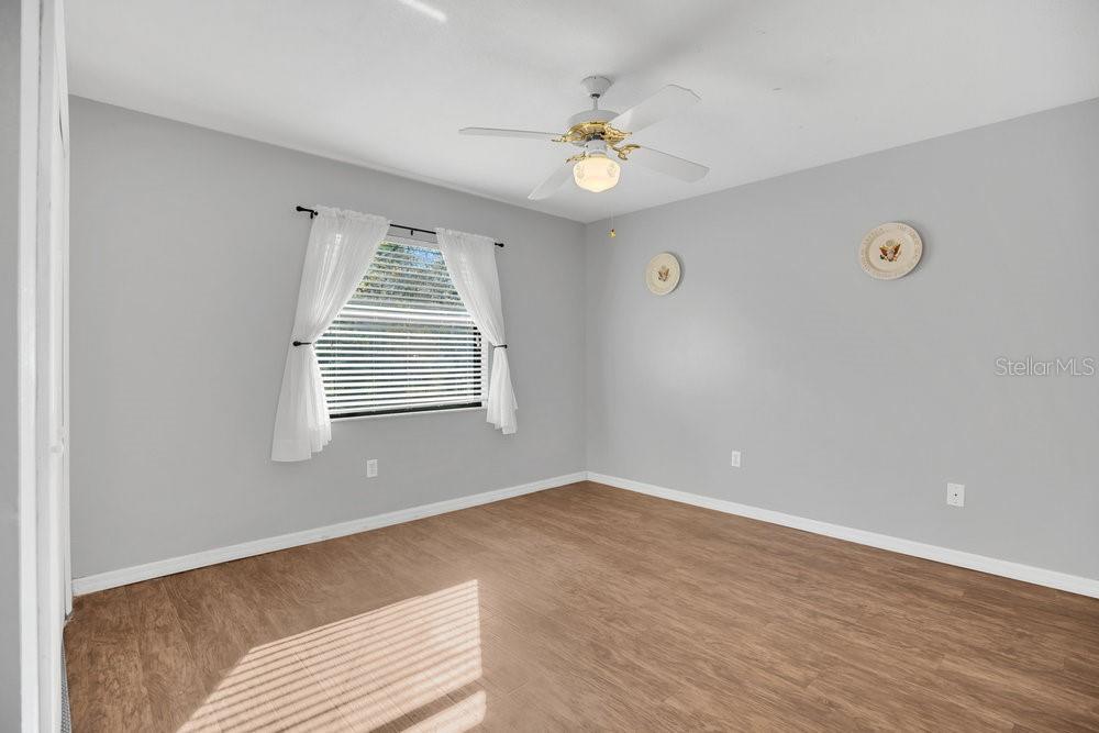 90 Sundown Road DeBary, FL 32713 - Photo 20 of 36 wooden floor in an empty room with a window