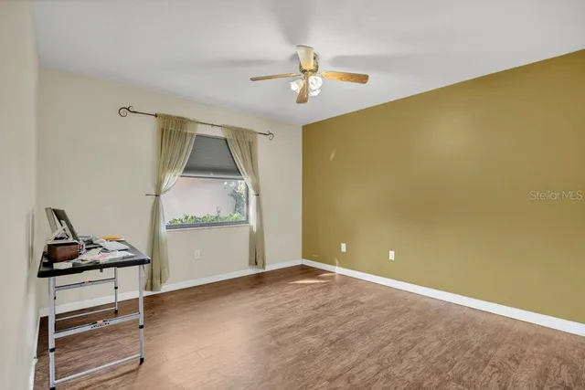 a view of room with cabinet and air conditioner vent