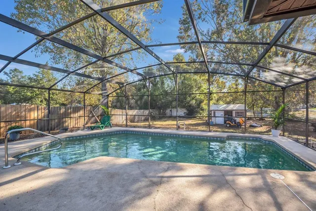 a view of yard with swimming pool