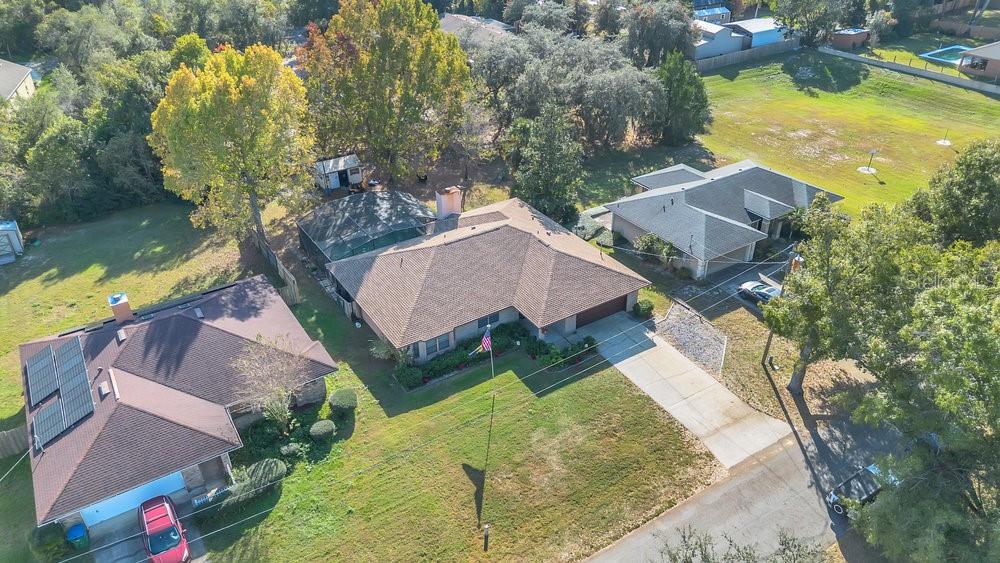 90 Sundown Road DeBary, FL 32713 - Photo 31 of 36 an aerial view of a house with swimming pool and lake view