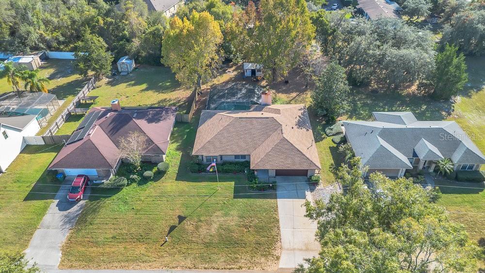 90 Sundown Road DeBary, FL 32713 - Photo 32 of 36 an aerial view of house with yard and swimming pool