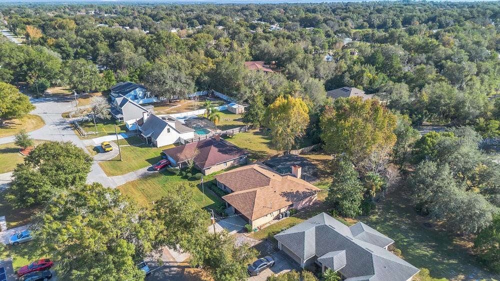 90 Sundown Road DeBary, FL 32713 - Photo 33 of 36 an aerial view of residential house with outdoor space and parking