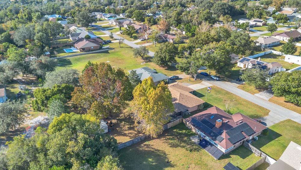 90 Sundown Road DeBary, FL 32713 - Photo 35 of 36 an aerial view of residential houses with outdoor space and swimming pool