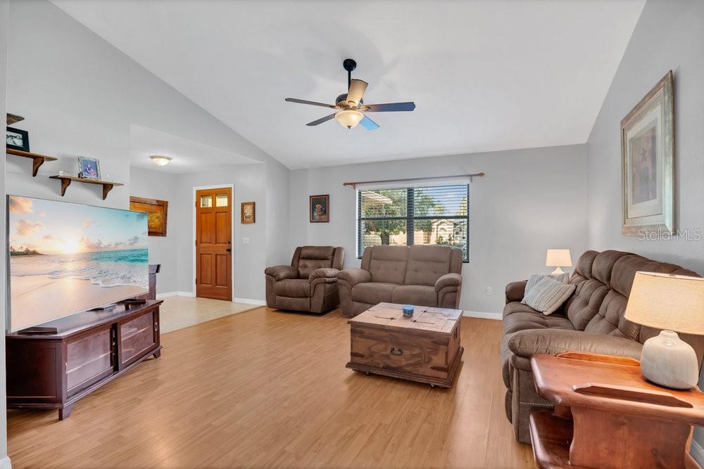 90 Sundown Road DeBary, FL 32713 - Photo 5 of 36 a living room with furniture fireplace and a window