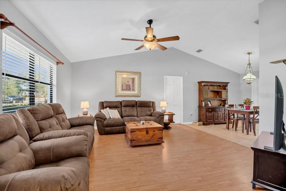 90 Sundown Road DeBary, FL 32713 - Photo 7 of 36 a living room with furniture and a large window