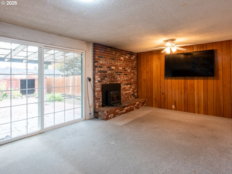 2563 York Street Eugene, OR 97404 - Photo 13 of 44 a view of a flat screen tv with a fireplace in front of it