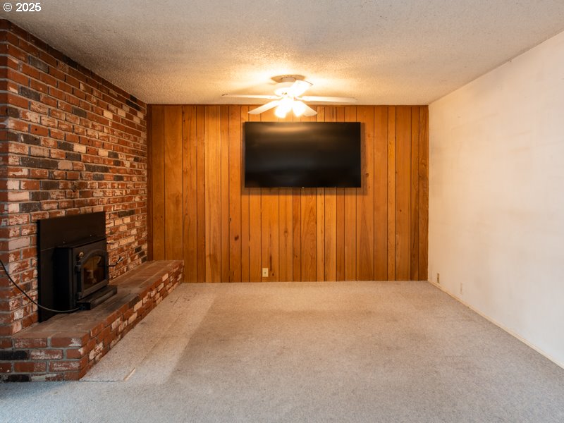 2563 York Street Eugene, OR 97404 - Photo 14 of 44 a view of a livingroom with a flat screen tv and a fireplace