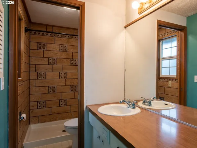 a bathroom with a bathtub and shower