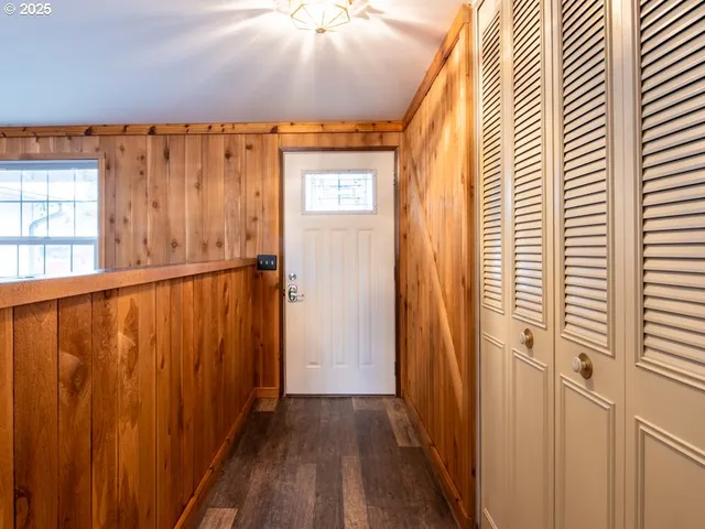 an entryway with wooden floor