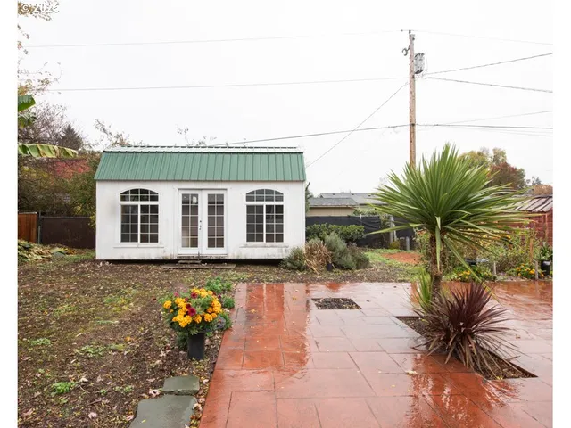 a view of a backyard with a sitting area
