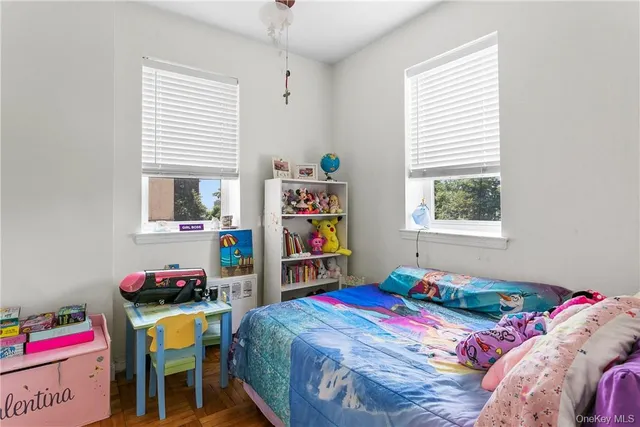 a bedroom that has a bed on it and a window