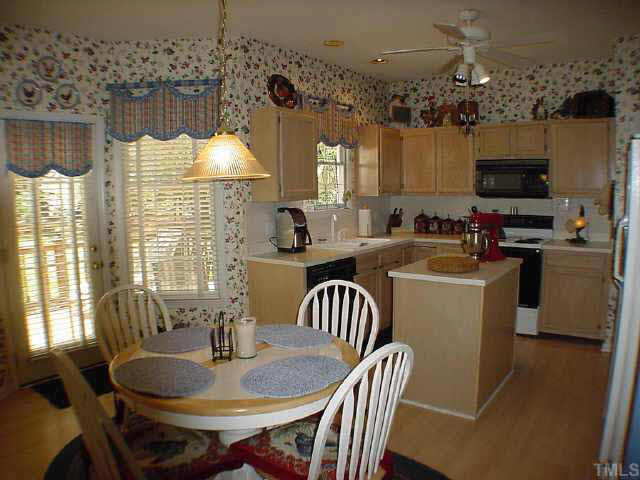 8801 Attingham Drive Raleigh, NC 27615 - Photo 3 of 10 Kitchen center island, lovely bay window area with door to fabulous back deck and yard Other