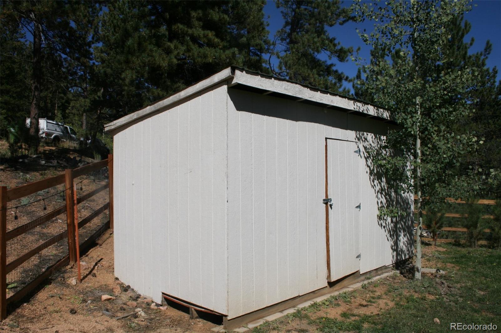 238 Taylor Street Bailey, CO 80421 - Photo 11 of 23 a side view of a house with backyard