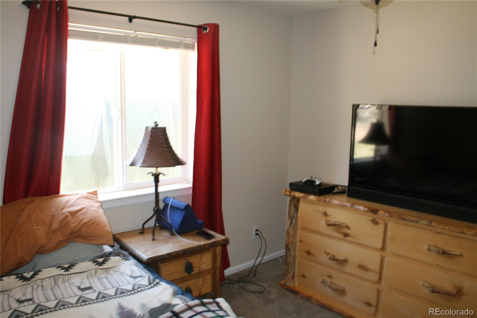 238 Taylor Street Bailey, CO 80421 - Photo 19 of 23 a living room with furniture and a flat screen tv