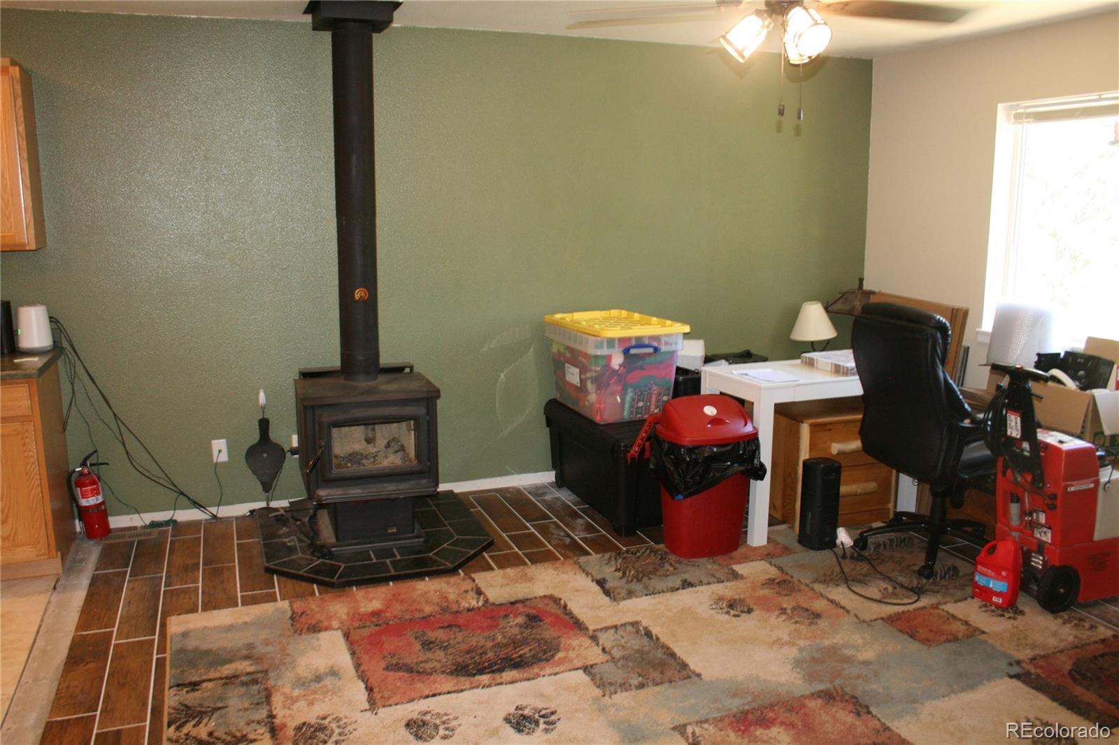 238 Taylor Street Bailey, CO 80421 - Photo 20 of 23 a view of a room with gym equipment