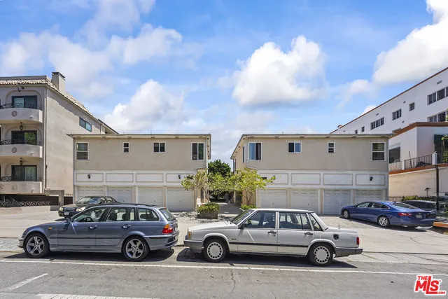 a view of a car parked in front of a building