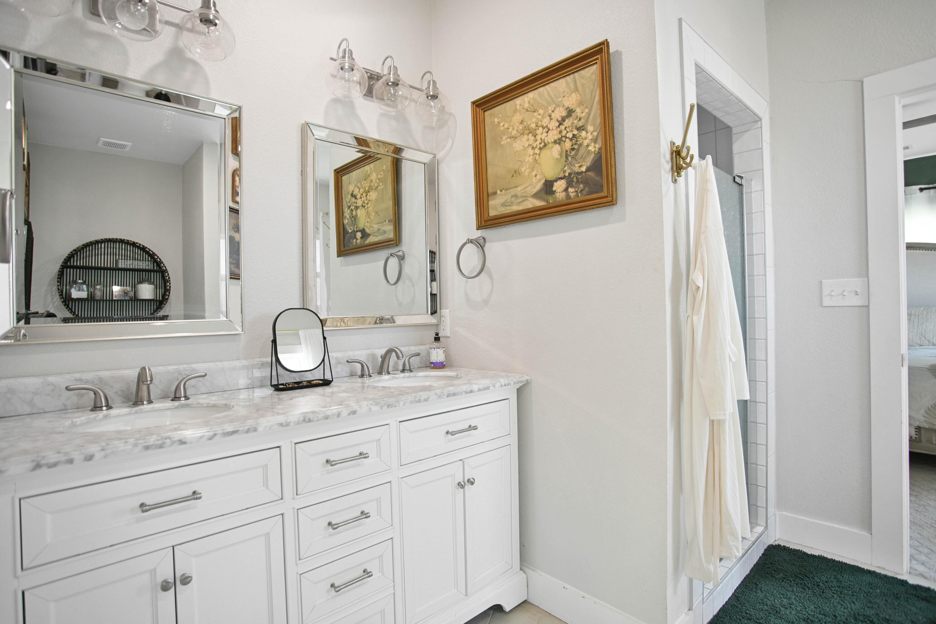 3091 County Road 3 Slaton, TX 79364 - Photo 20 of 41 a bathroom with a granite countertop sink and a mirror