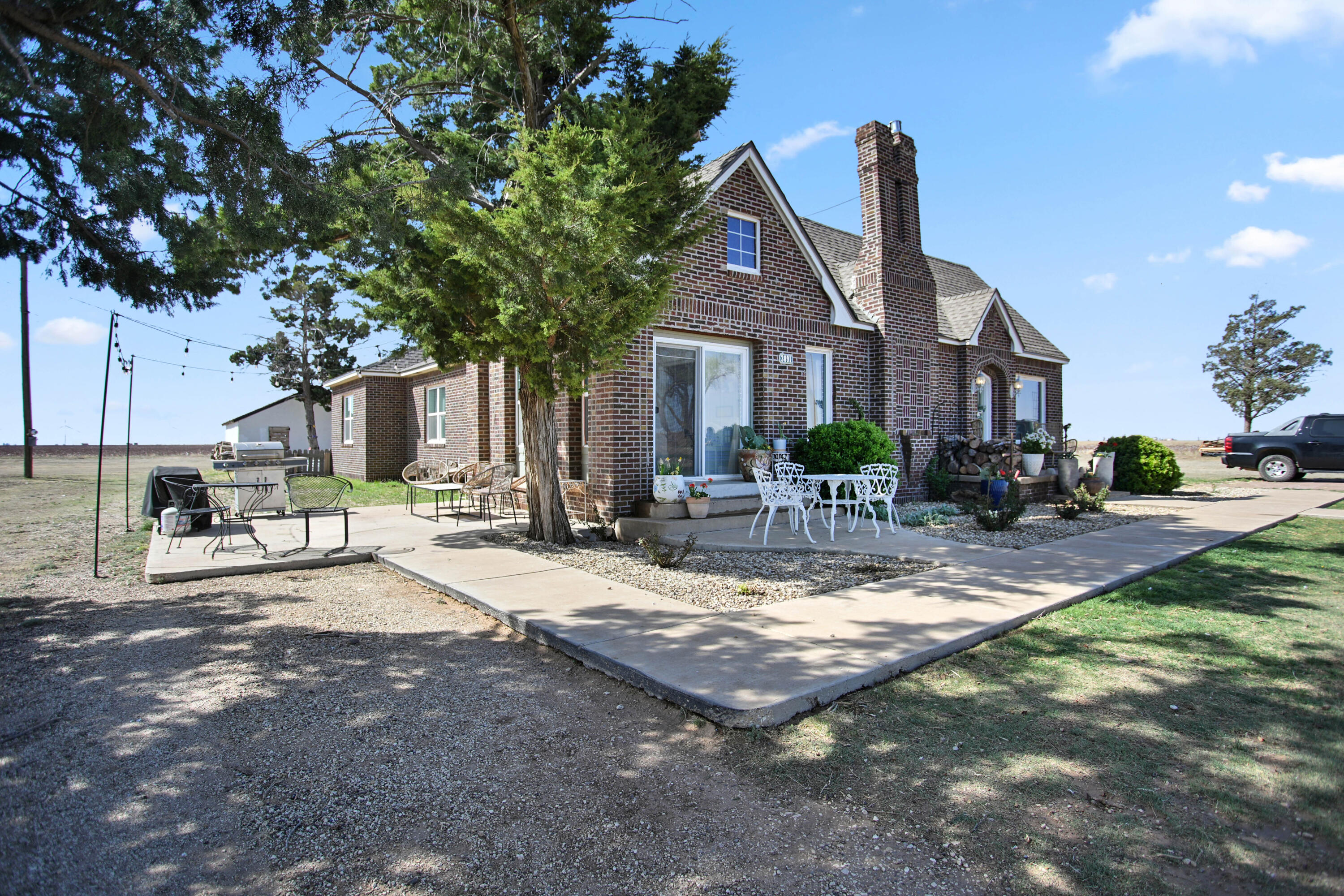 3091 County Road 3 Slaton, TX 79364 - Photo 2 of 41 a front view of a house with yard patio and green space