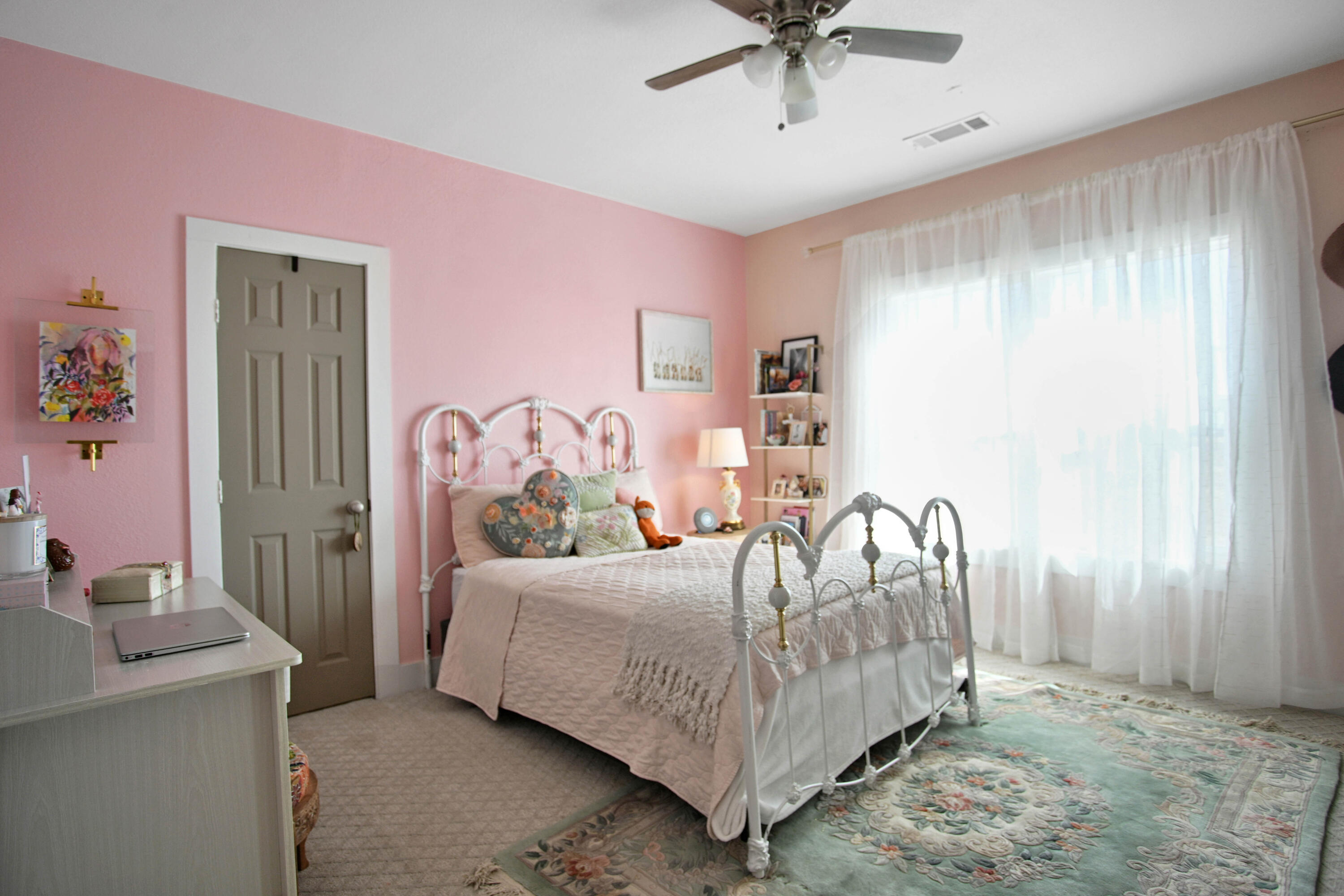 3091 County Road 3 Slaton, TX 79364 - Photo 23 of 41 a bedroom with a bed and a chandelier